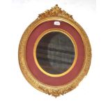 A Late Victorian Carved Giltwood Oval Picture Frame, the flower carved border with leaf and flower