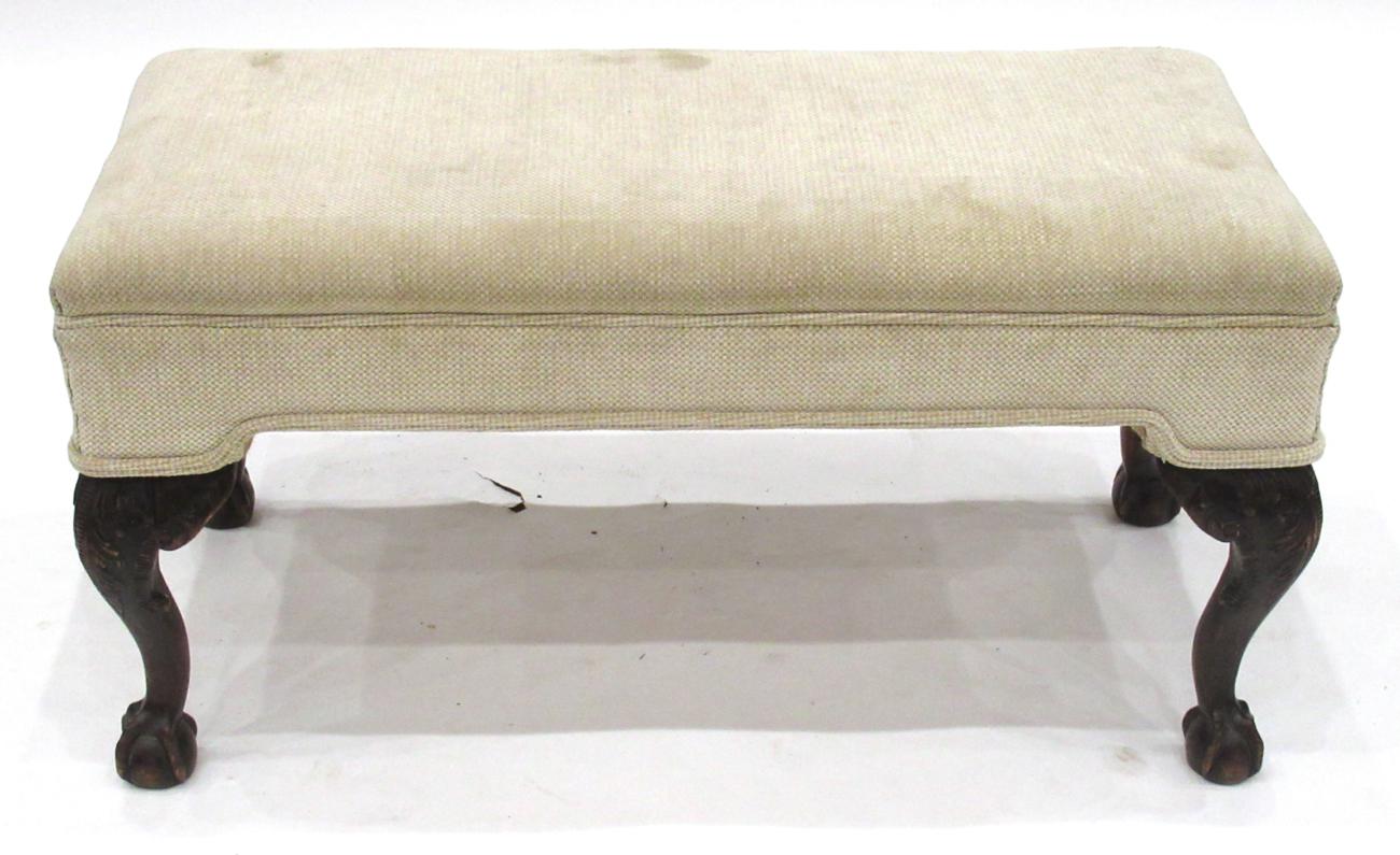 A Carved Mahogany Window Seat, probably 19th century, recovered in a modern cream fabric with