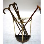 A Brass Stick Stand, late 19th century, of demi-lune form with baluster finials, 63cm high, with