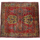 Ushak Carpet Central/West Anatolia, circa 1900 The tomato red field with columns of diamond and