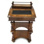 A Victorian Figured Walnut and Boxwood Strung Davenport, late 19th century, the hinged lid with a