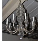 A 20th Century Cut Glass Eight-Branch Chandelier, with thistle cut sockets containing candles