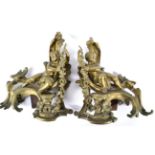 A Pair of French Brass Chenet, in rococo style, of scroll moulded form cast with cherubs holding