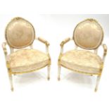 A Pair of Cream Painted and Parcel Gilt Fauteuils, late 19th century, covered in worn cream silk