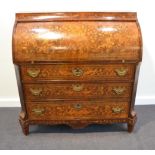 A 19th Century Dutch Mahogany and Marquetry Inlaid Cylinder Bureau, the top section inlaid with