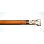 A Dresden Porcelain Mounted Malacca Cane, late 19th century, the handle painted with a townscape and