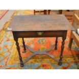An Oak Side Table, Late 17th/Early 18th Century, the moulded top above a long frieze drawer with