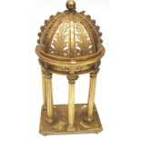 A Carved Giltwood Shrine, the domed canopy top carved and pierced with leaves above a dentil and