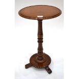 A Mid 19th Century Circular Tripod Table, the moulded top on a baluster base with circular base