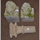 A Pair of Carved Limestone Corbels, in 14th century style, carved with the heads of a man and woman,