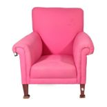 A Victorian Armchair, circa 1880, covered in pink cotton fabric with rounded arms and overstuffed