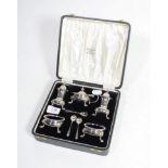 A cased five piece silver condiment set by Aidie Bros