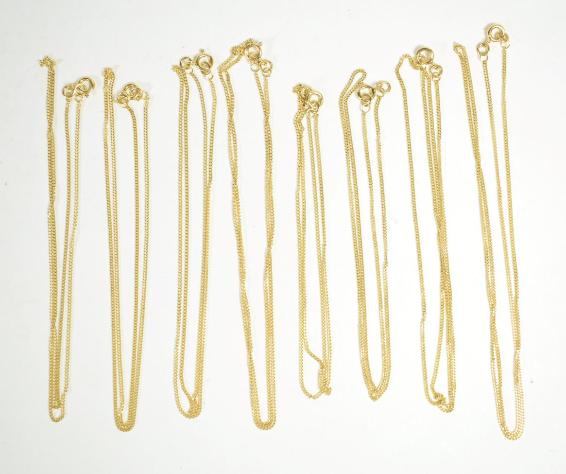 Eight 18 carat gold trace link chains, lengths 2 x 41.5cm, 4 x 47cm, and 2 x 51cm (9). Gross