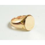 A yellow metal signet ring, finger size Q1/2. Unmarked, gross weight 9.8 grams.