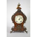 A walnut metal mounted striking mantel clock, movement stamped ''1 million, Lenzkirch''