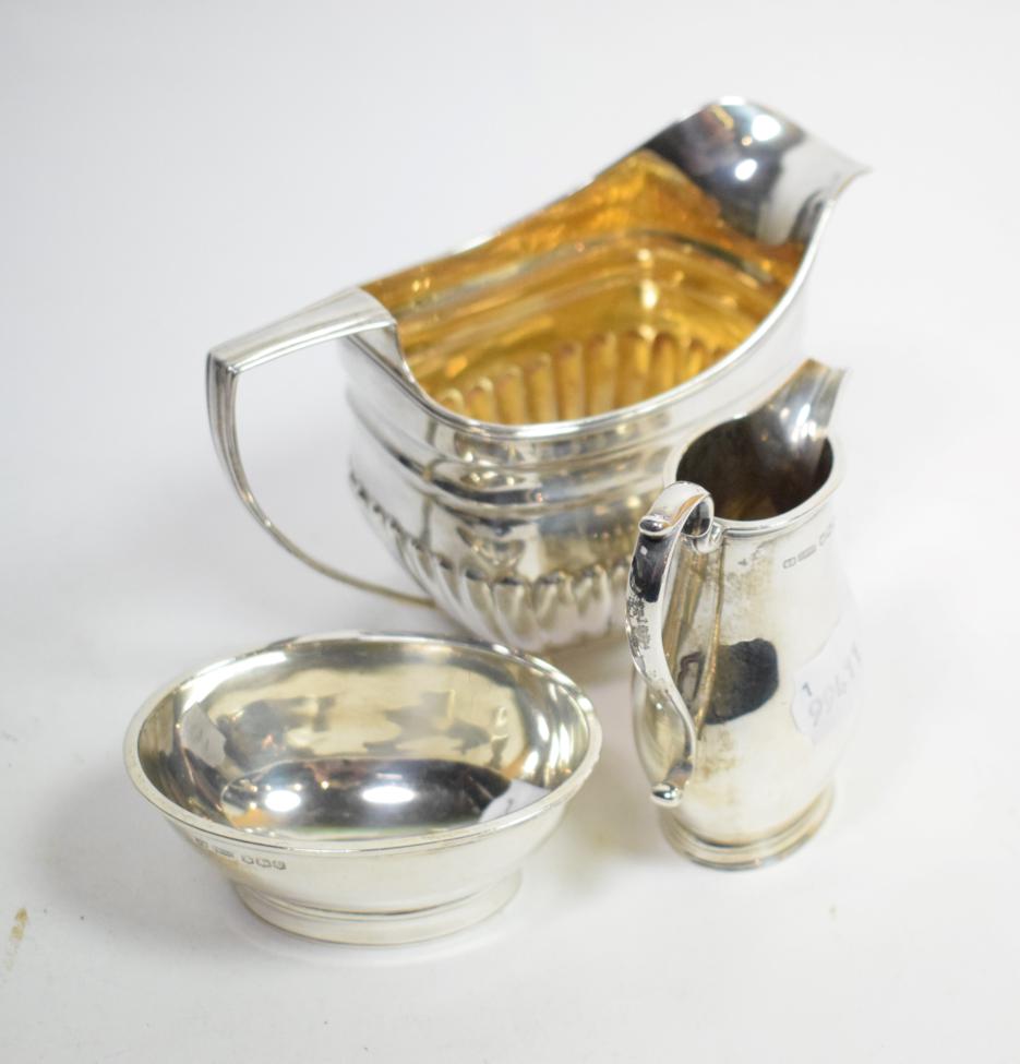 A late George III silver cream jug, crested; and an 18th century style silver morning cream and