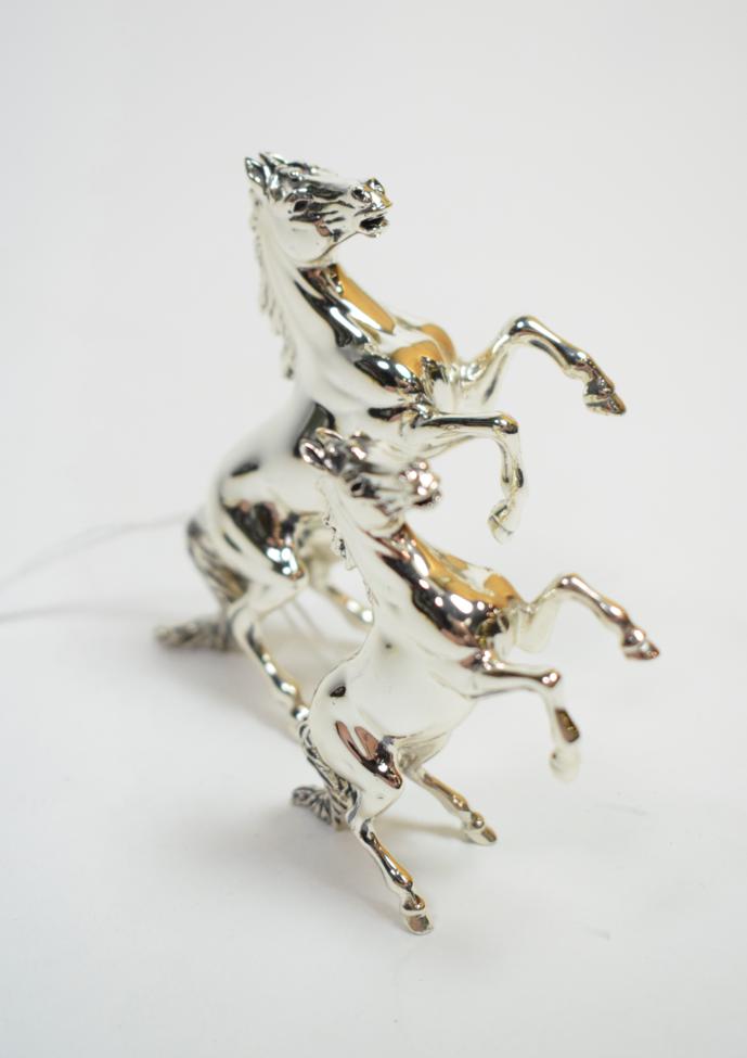 Two modern cast silver models of rearing horses, London 2006, the largest 10cm long, 4.9ozt (2)