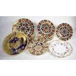 A shelf of Royal Crown Derby Imari; dinner plates; bowls etc together with a Royal Crown Derby