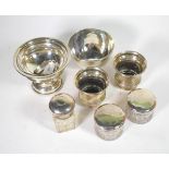 A selection of silver comprising two beakers; two ingots; a Victorian bowl; a pedestal bowl; and