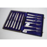 Six pairs of Edwardian silver fruit knives and forks, Allen & Darwin, Sheffield 1905, with mother of