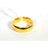 An 18 carat gold band ring, finger size T. Gross weight 10.47 grams