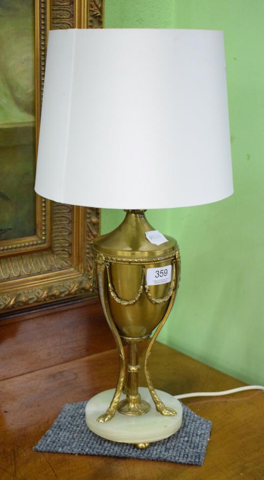 A gilt metal and onyx table lamp
