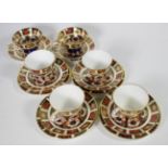 A tray of Royal Crown Derby teacups, saucers and side plates