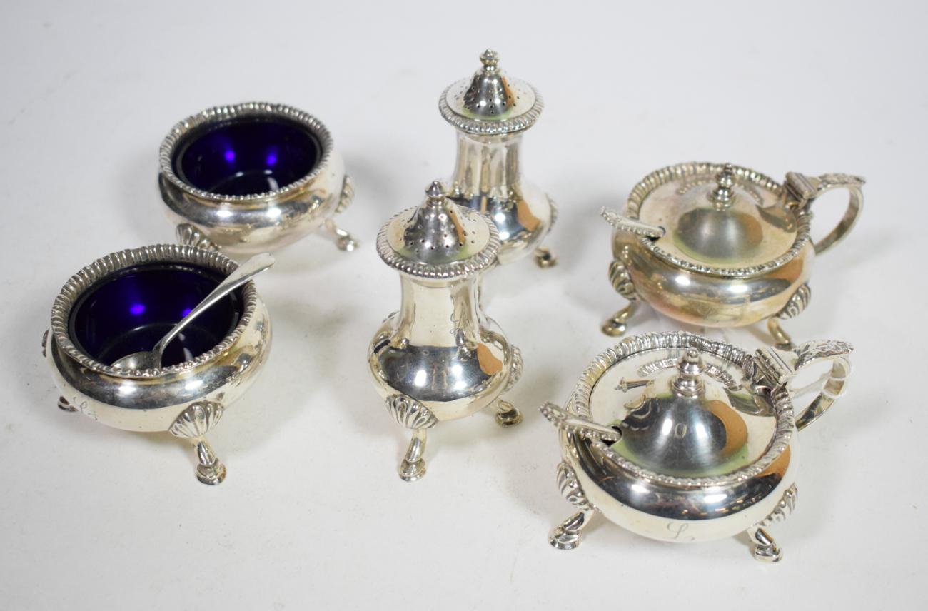 A six piece silver condiment set, Walker & Hall, London 1960, with straight gadroon border on