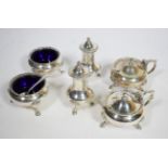 A six piece silver condiment set, Walker & Hall, London 1960, with straight gadroon border on