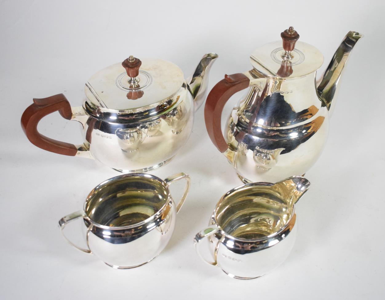 A silver four piece tea and coffee service, Roberts & Belk, Sheffield 1963, of plain oval bellied