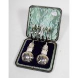 A pair of Victorian silver pepper pots, Walker & Hall, Sheffield 1893, part spirally fluted and with