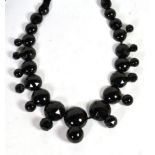 A Victorian black jet faceted and half cabochon linked necklace