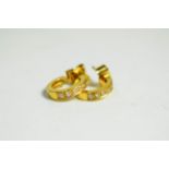A pair of 18 carat gold and diamond earrings, with post fittings for pierced ears (2). Gross