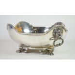 A silver fruit bowl, Elkington & Co., Birmingham, 1923, with shaped rim, twin lion mask drop