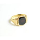 A 22 carat gold hardstone signet ring, finger size L1/2. Gross weight - 6.4 grams