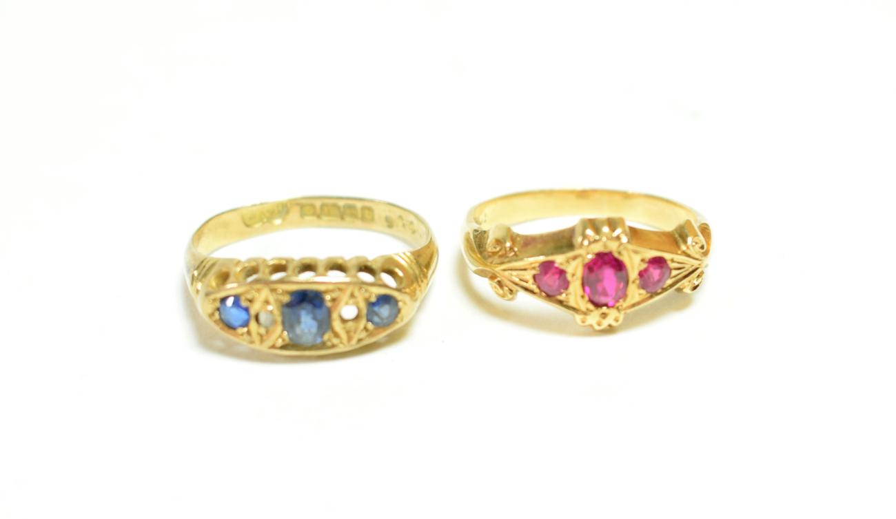 An 18 carat gold sapphire and diamond ring (one diamond missing), finger size N; and a ruby and