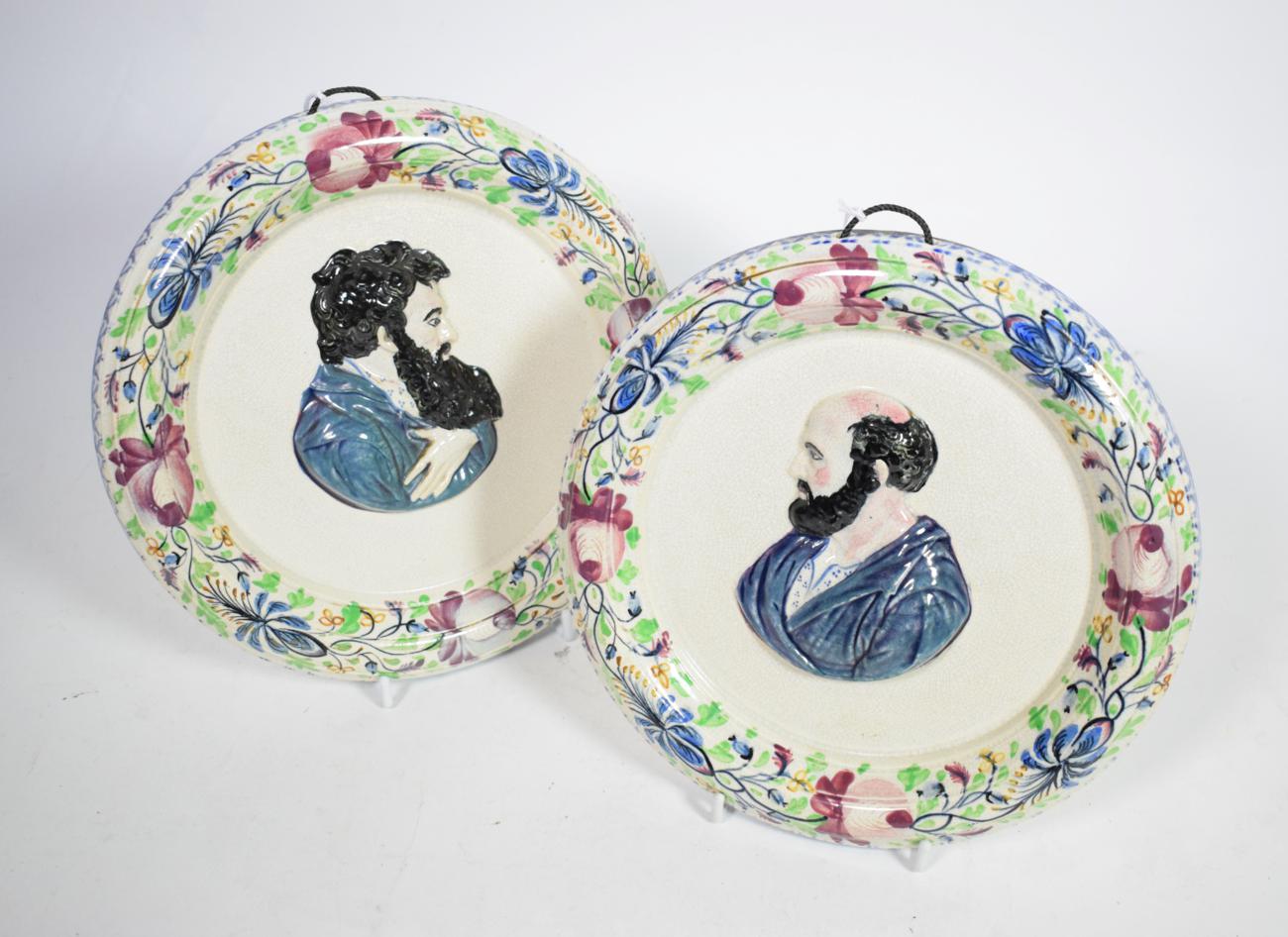 A pair of Portobello pottery wall plaques, circa 1820, moulded in relief and painted with bust