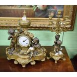 A bronze and gilt bronze Continental figural mantle clock, with an urn surmount above a pair of