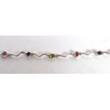 An 18 carat white gold multi-gem set bracelet, length 19.5cm . Gross weight - 8.16 grams