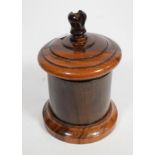 A 19th century treen string box, the cover with cutter finial