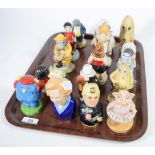 Sixteen collectable figures including Doulton, Wade, Beswick etc