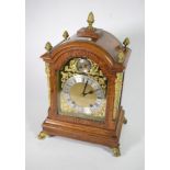 An oak quarter striking mantel clock