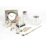 Mixed silver items comprising: two silver mounted bedside timepieces, the largest timepiece 10cm