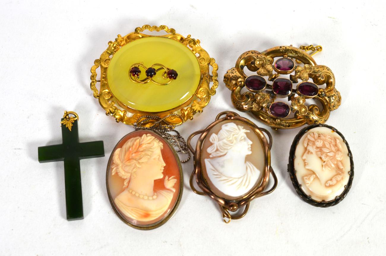 A Victorian yellow metal amethyst set brooch; measures 3.75cm by 5.25cm; a garnet and yellow metal