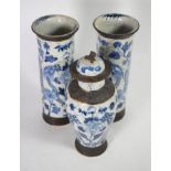 A garniture of three Chinese blue and white porcelain vases, decorated with dragons