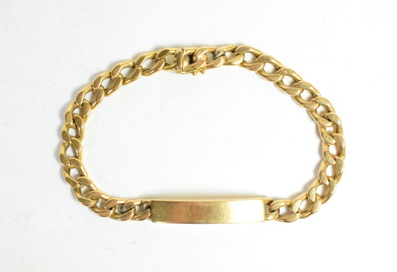A curb link identity bracelet with clasp stamped '750', length 24.5cm . Gross weight - 21.37 grams.