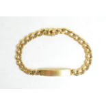 A curb link identity bracelet with clasp stamped '750', length 24.5cm . Gross weight - 21.37 grams.