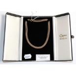 An 18 carat three colour gold rope necklace, length 41cm, in an Ogdens of Harrogate box . Gross