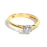 An 18 carat gold solitaire diamond ring, a round brilliant cut diamond in a claw setting, to knife