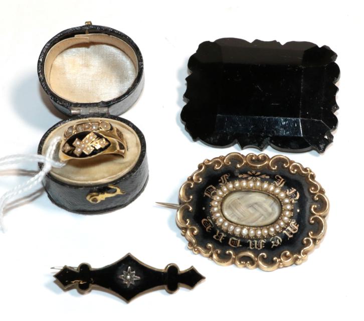 A collection of Victorian mourning jewellery, comprising of an 18 carat gold ring, finger size M;